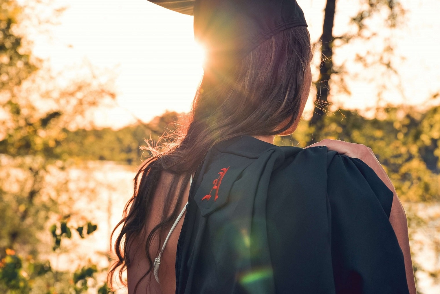 woman on graduation day with an associate degree